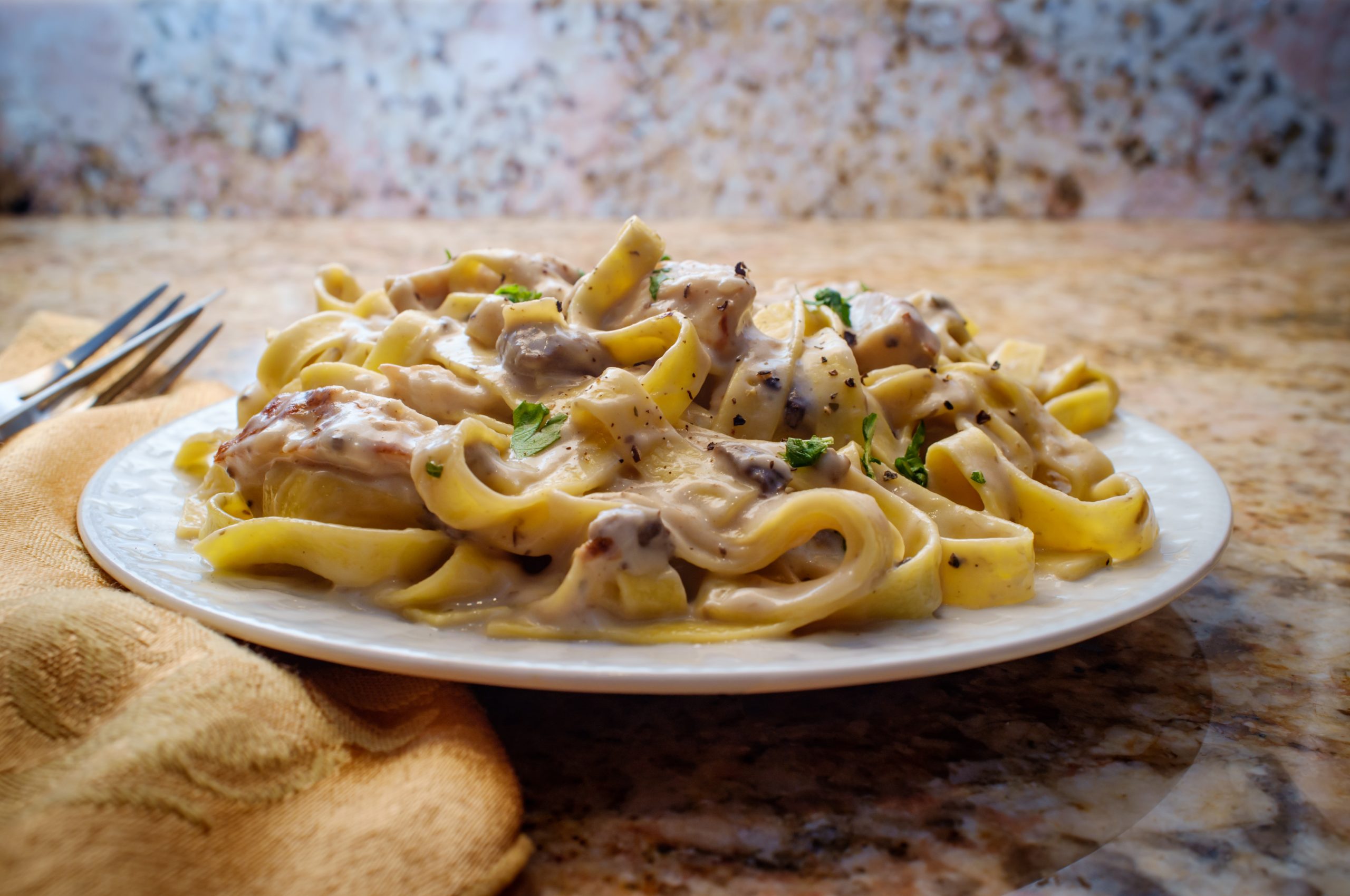 Fettuccine Alfredo Grilled Chicken Authentic Italian fettuccine alfredo pasta dish with grilled chicken breast