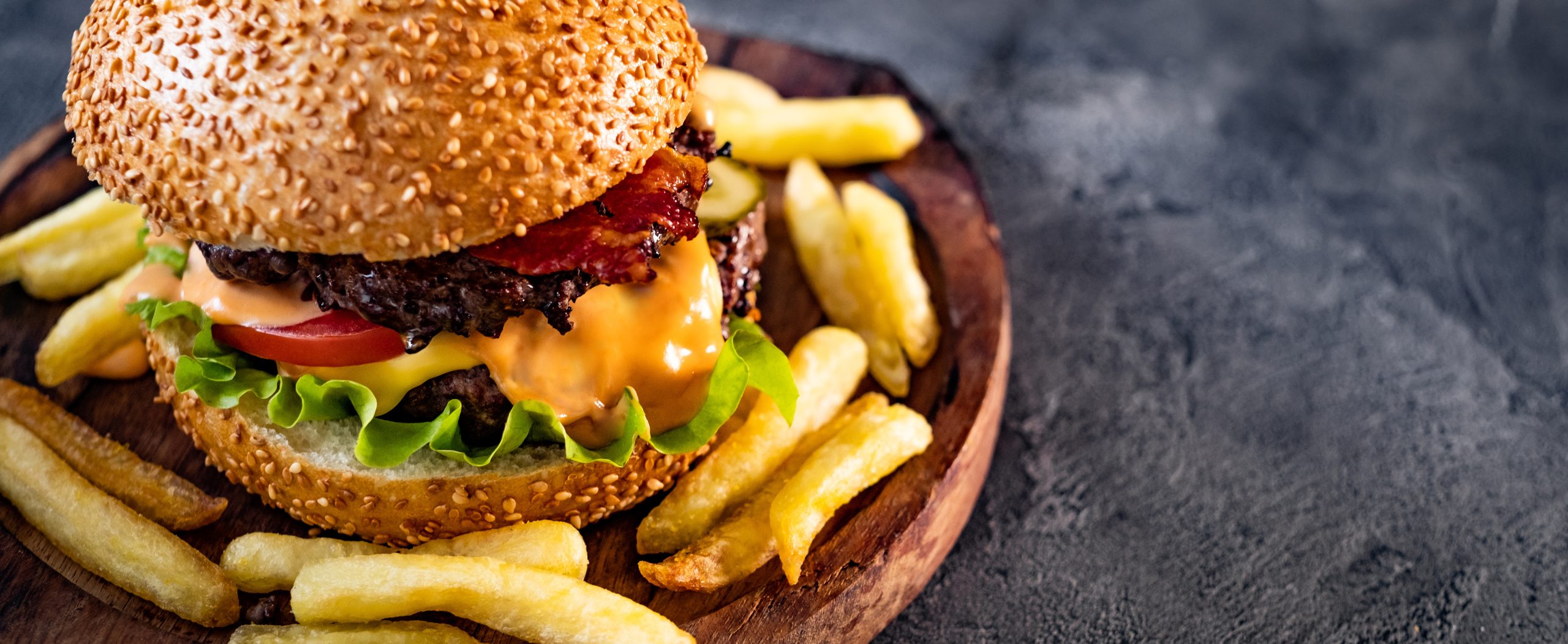Fresh tasty burger with french fries Fresh tasty burger with french fries on table